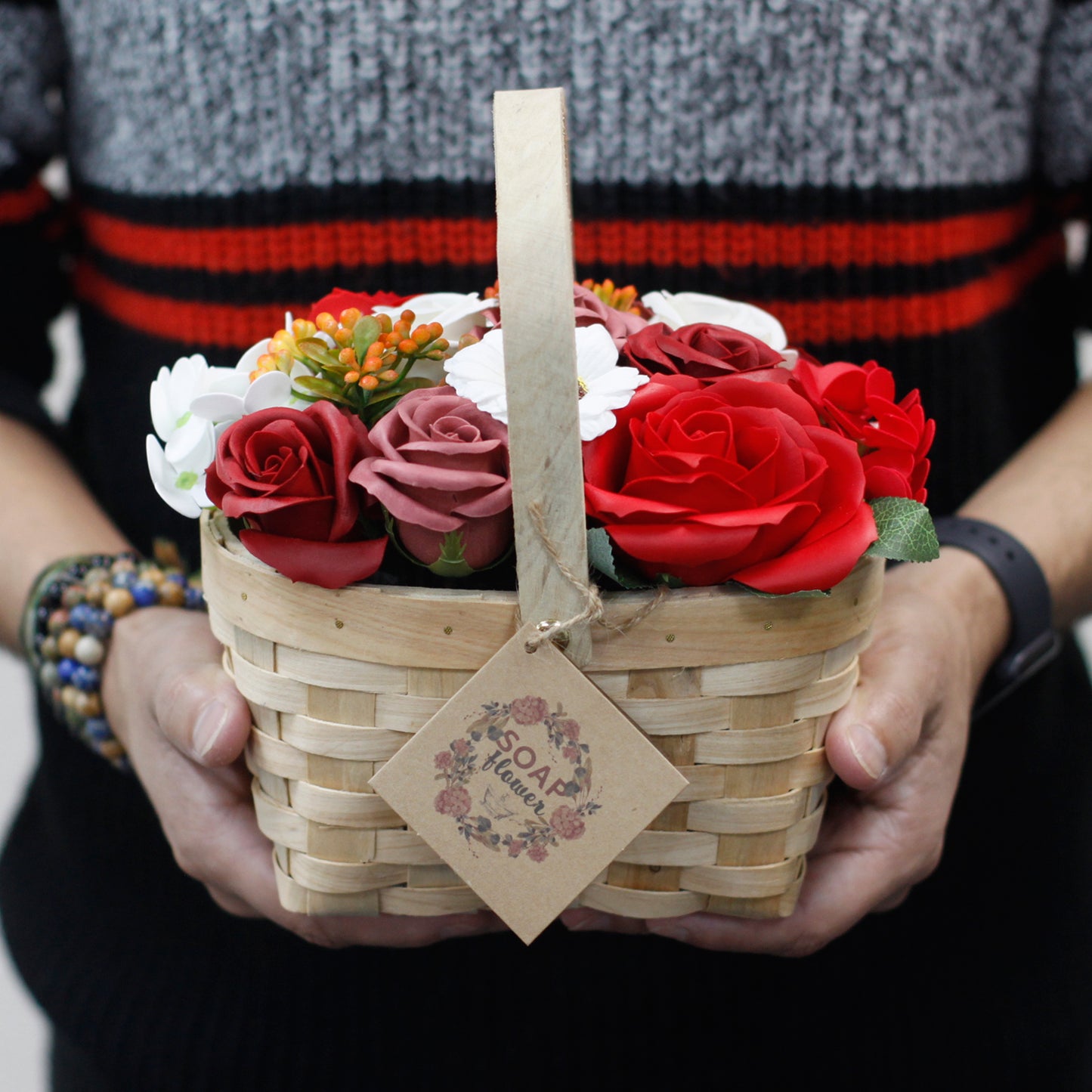 Large red bouquet of soap flowers in a wicker basket